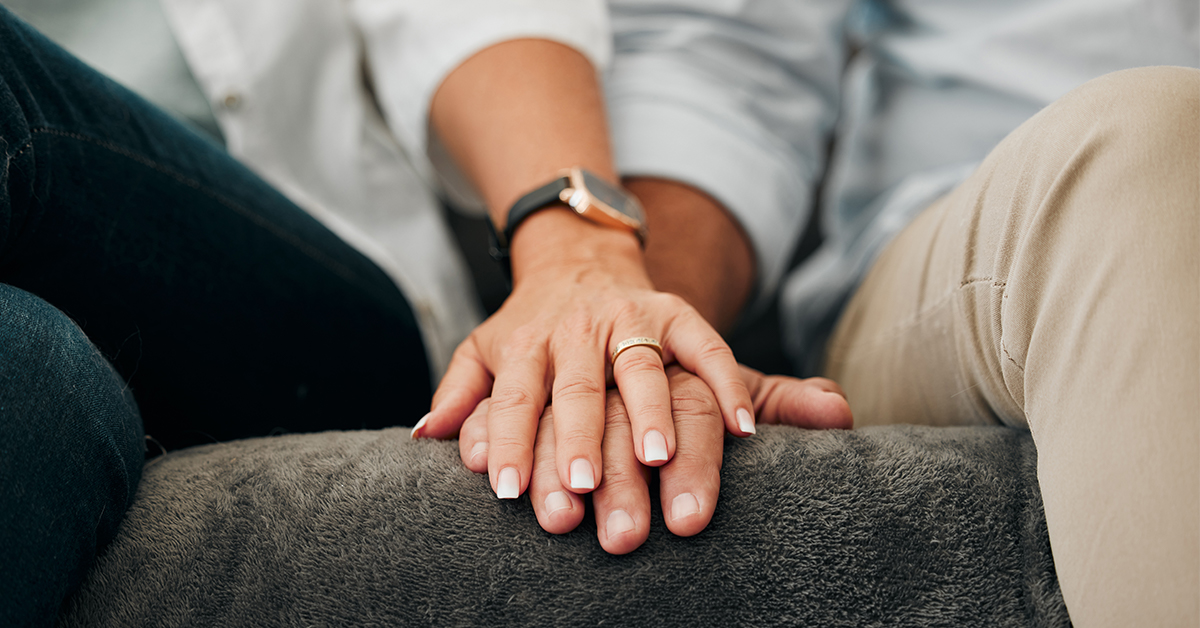 Married Couple Holding Hands in Counseling