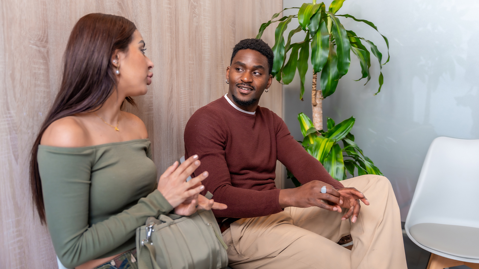 Couple talking in a waiting room