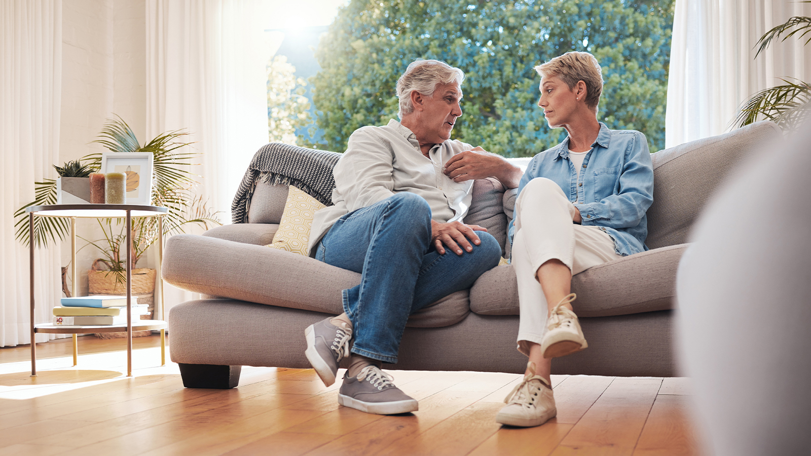 Shield Bearer | Conflict Resolution Strategies For Couples Senior couple having a conversation on a couch